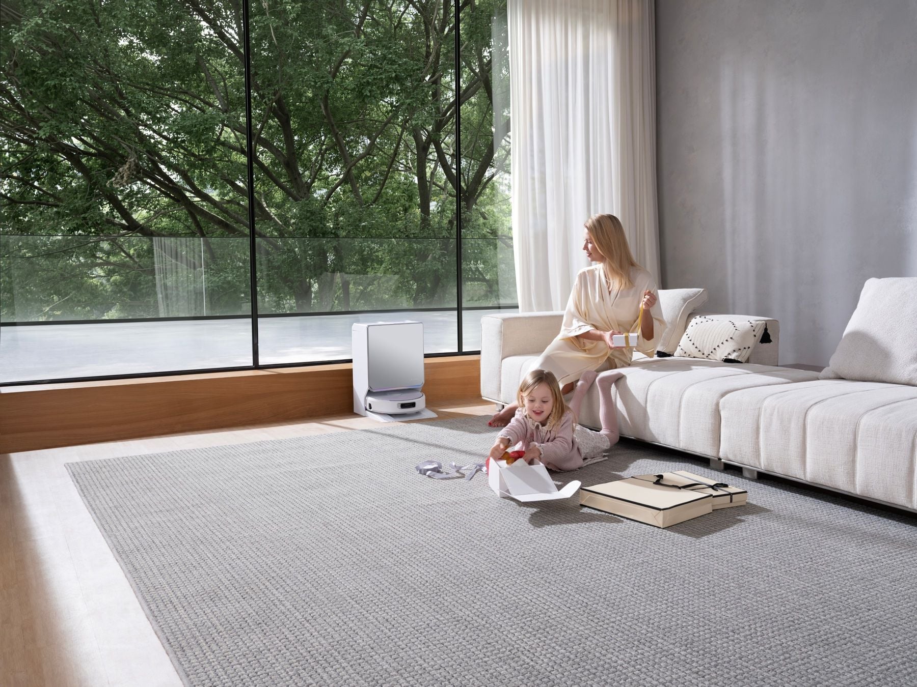 Narwal Flow 2 White docked in a sunlit minimalist living room
