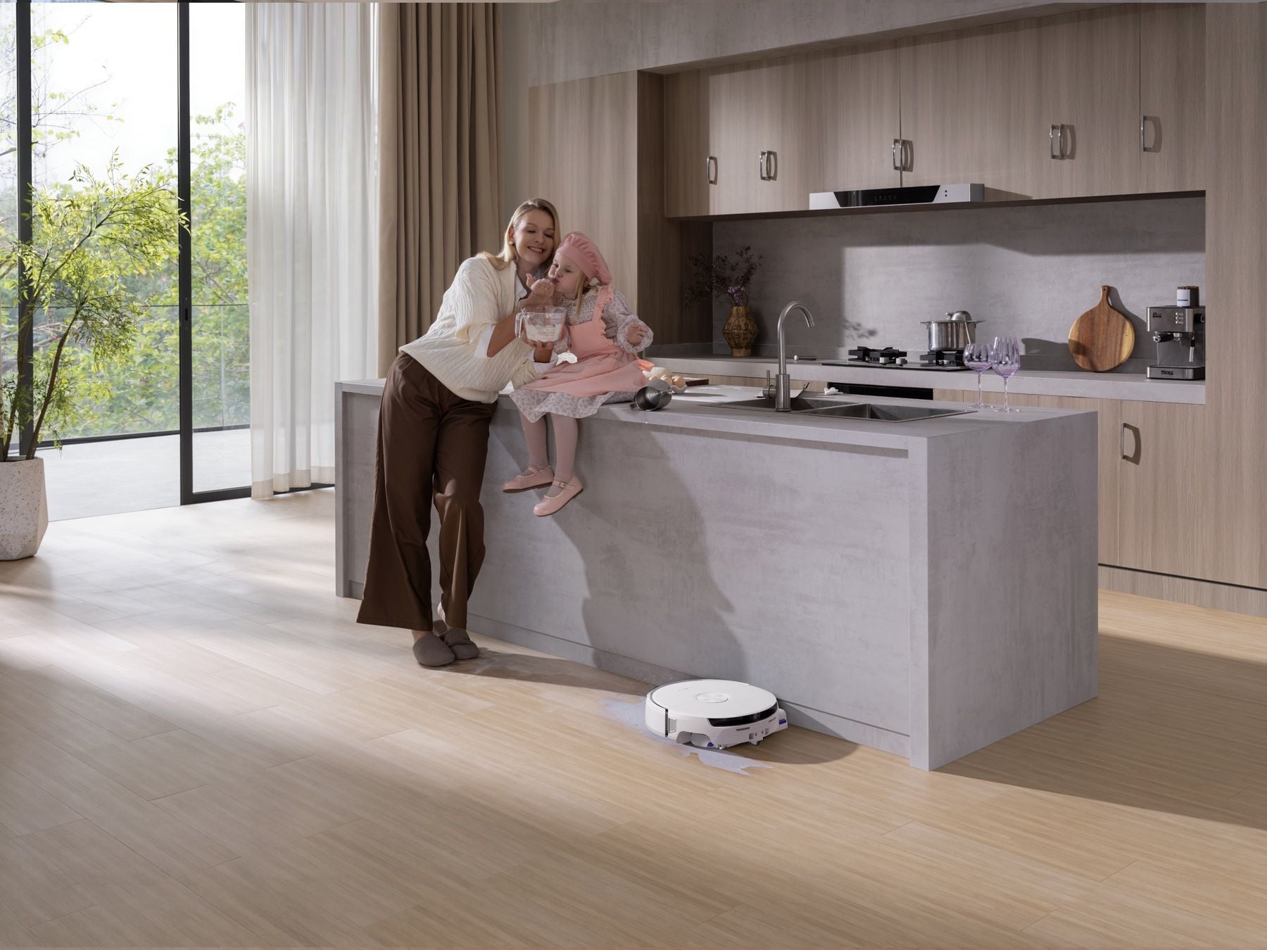 Narwal Flow 2 White mopping the floor of a bright modern kitchen