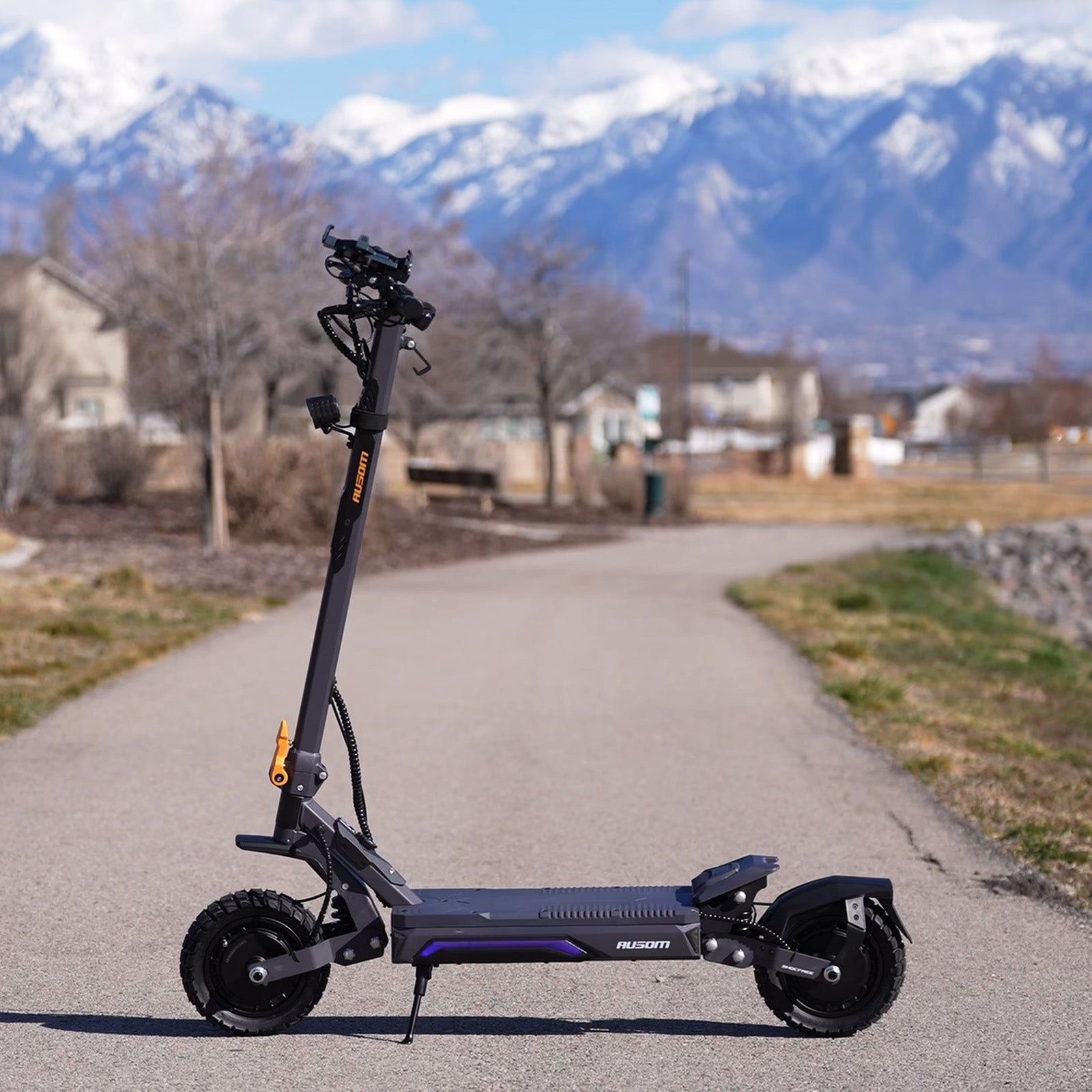 Ausom Gosoul 2 Pro Dual Motor electric scooter parked on a paved path