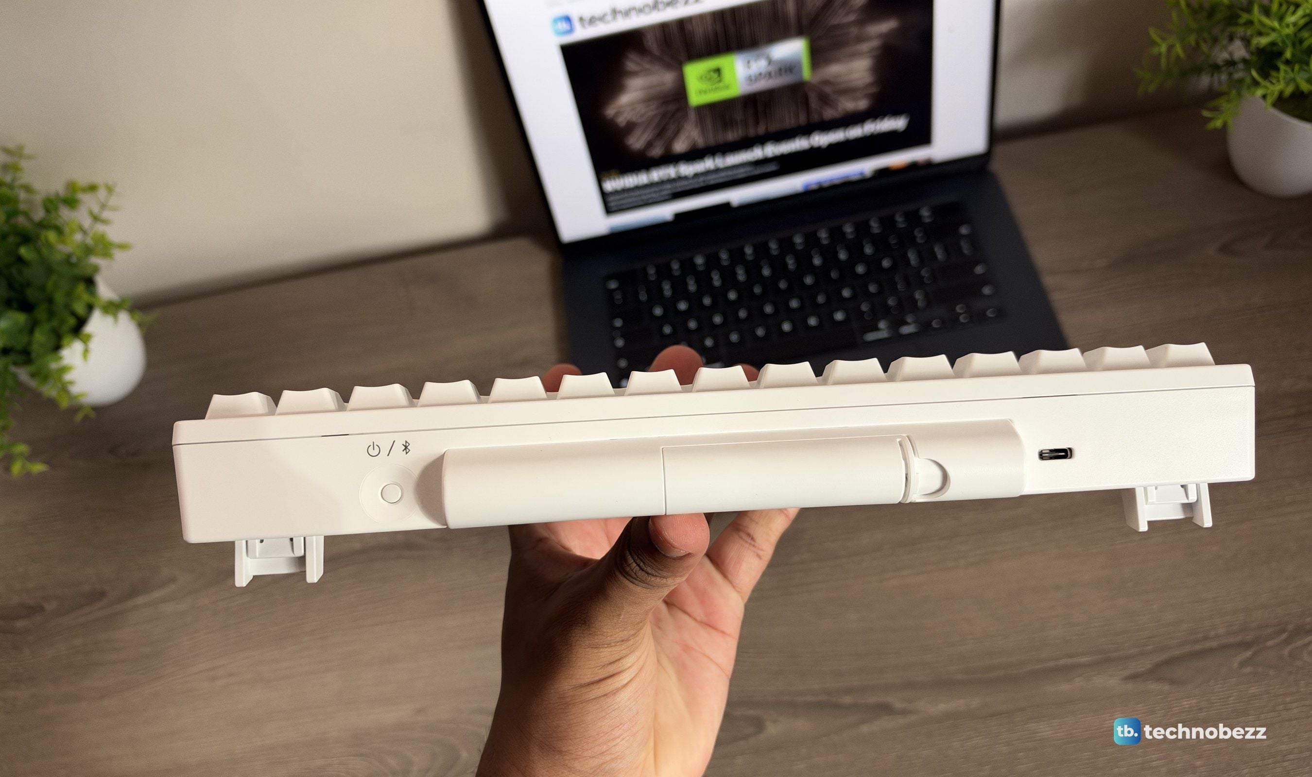 Rear edge of the HHKB showing the power switch, the AA battery hump, and the USB-C port