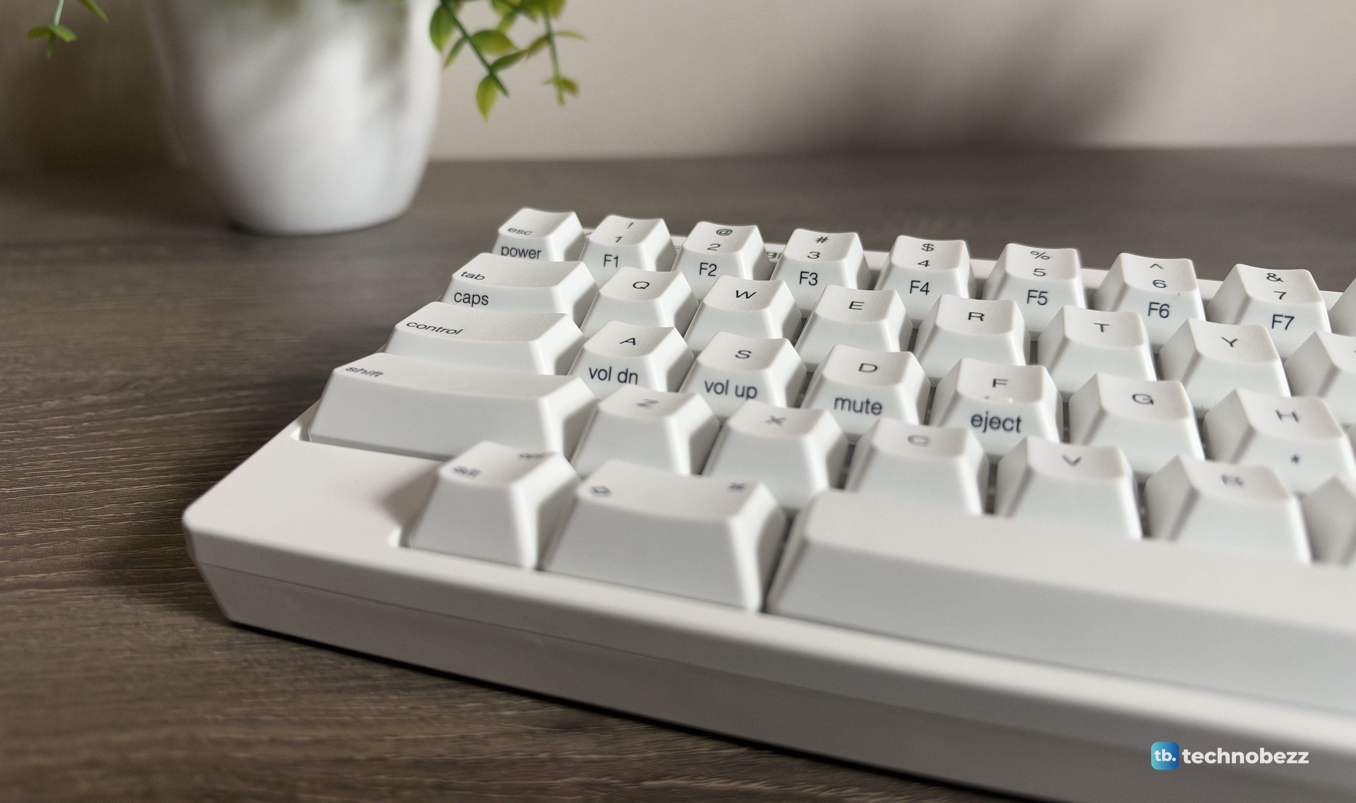 Close-up of the HHKB's printed PBT keycaps and sculpted rows from a low angle