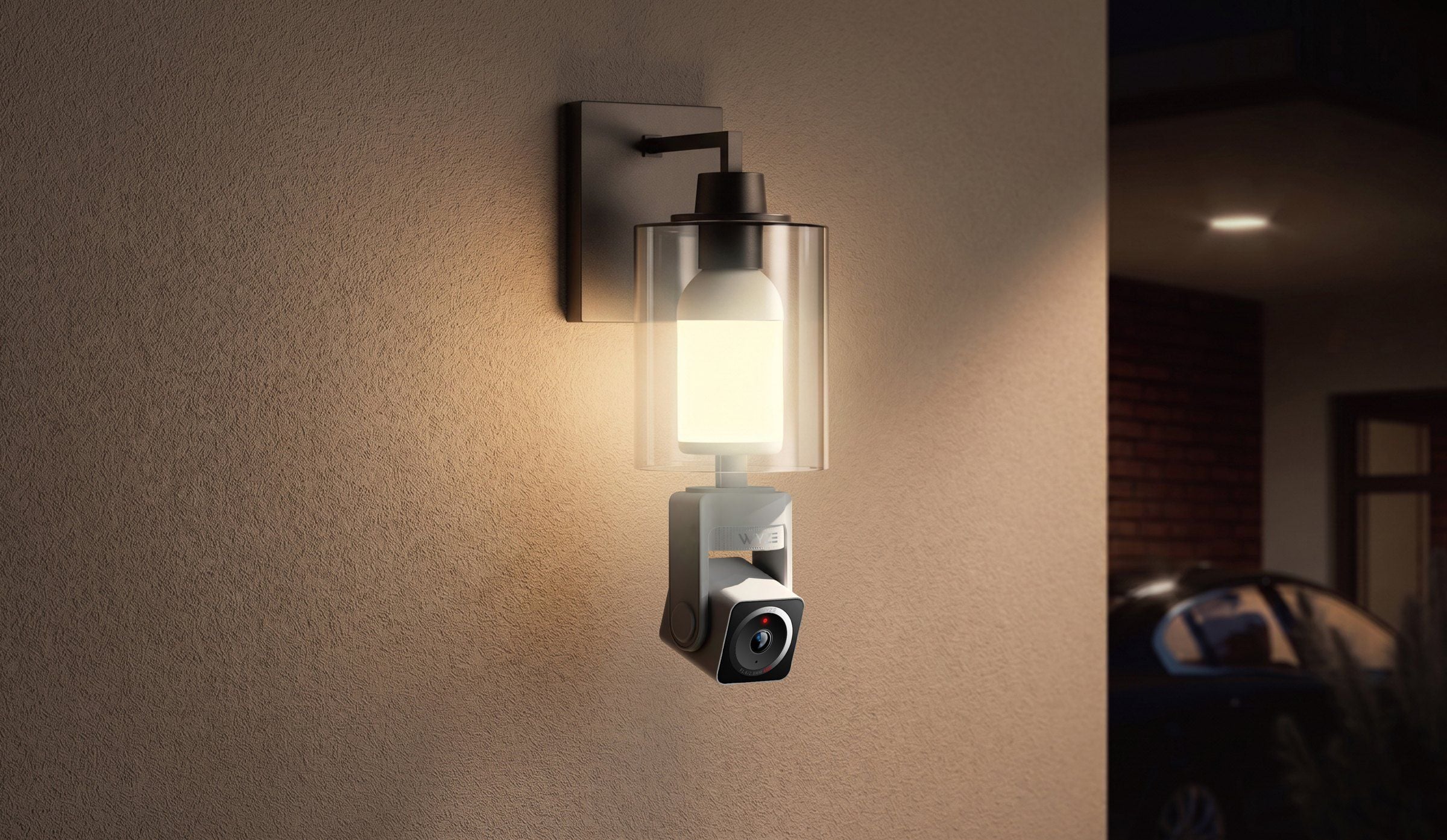 Wyze Bulb Cam Pan Color in a wall sconce at night