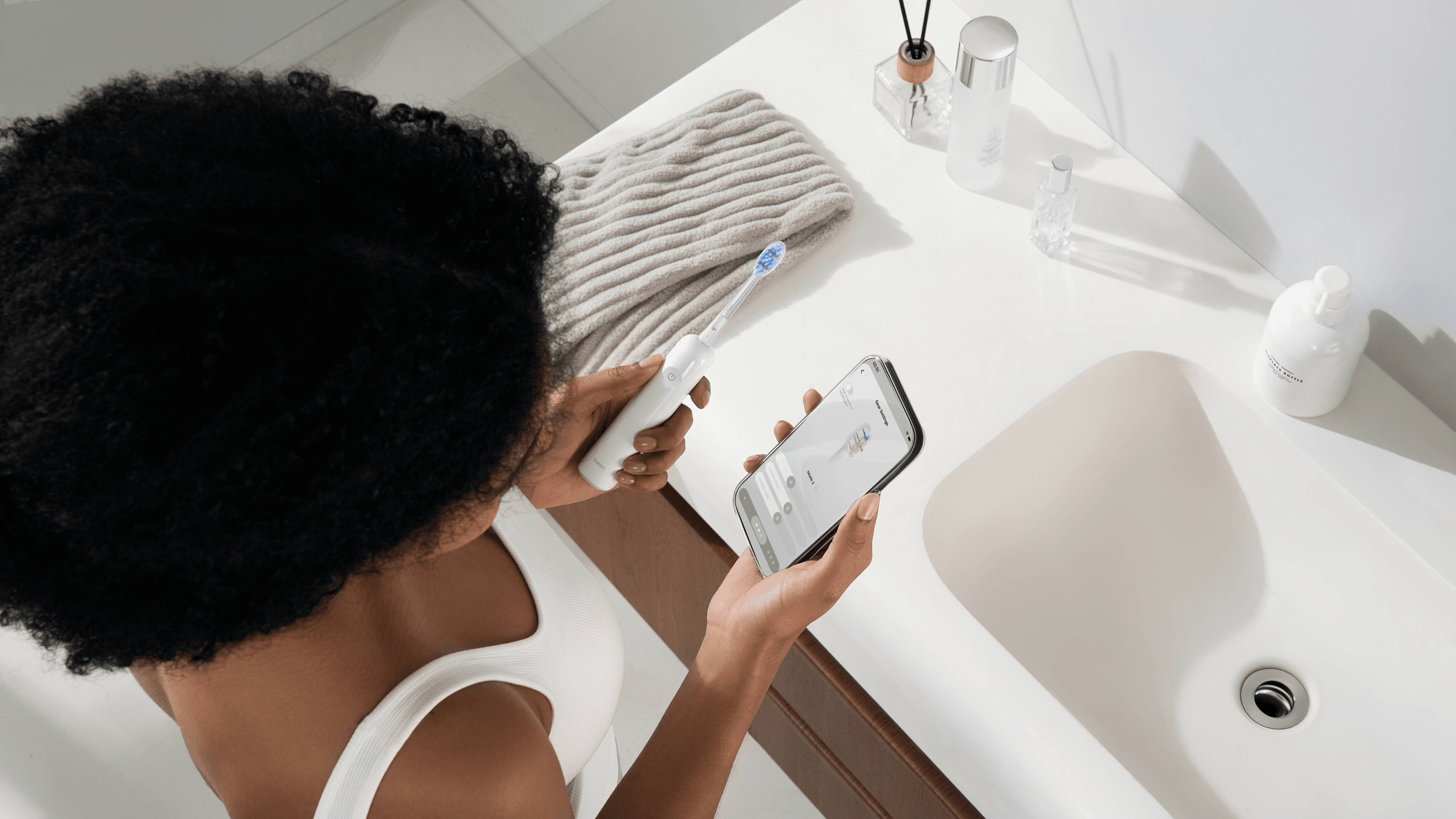 Two people brushing their teeth with Laifen Wave Pro electric toothbrushes