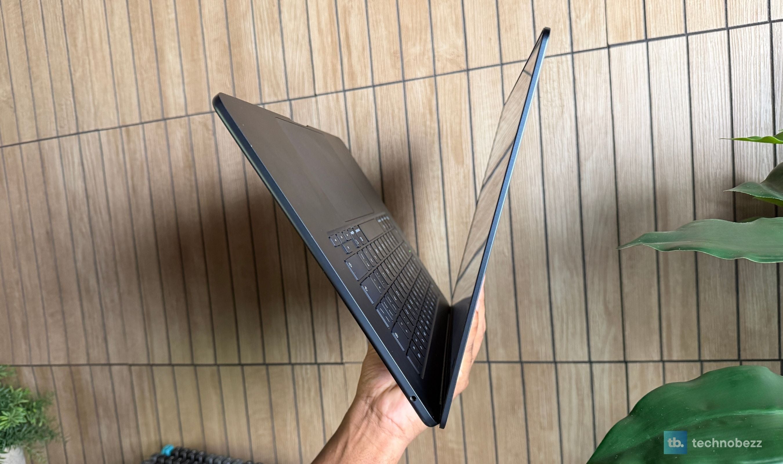 Side profile of an open 15-inch MacBook Air M5 showing its thin design