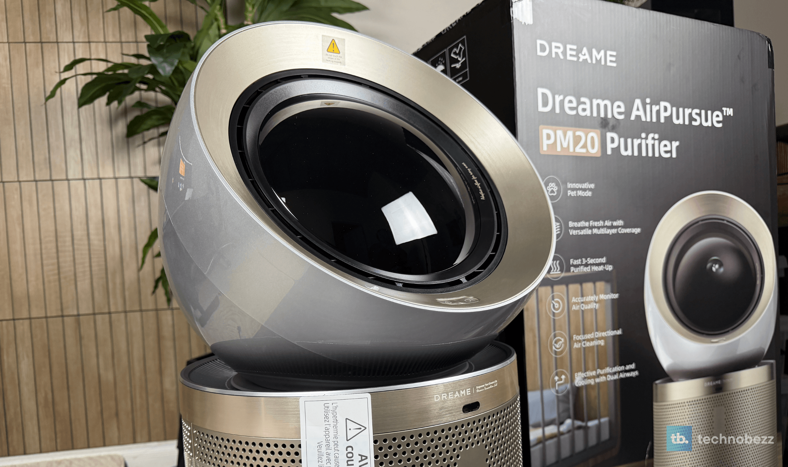Dreame AirPursue PM20 with its head angled upward in front of its box