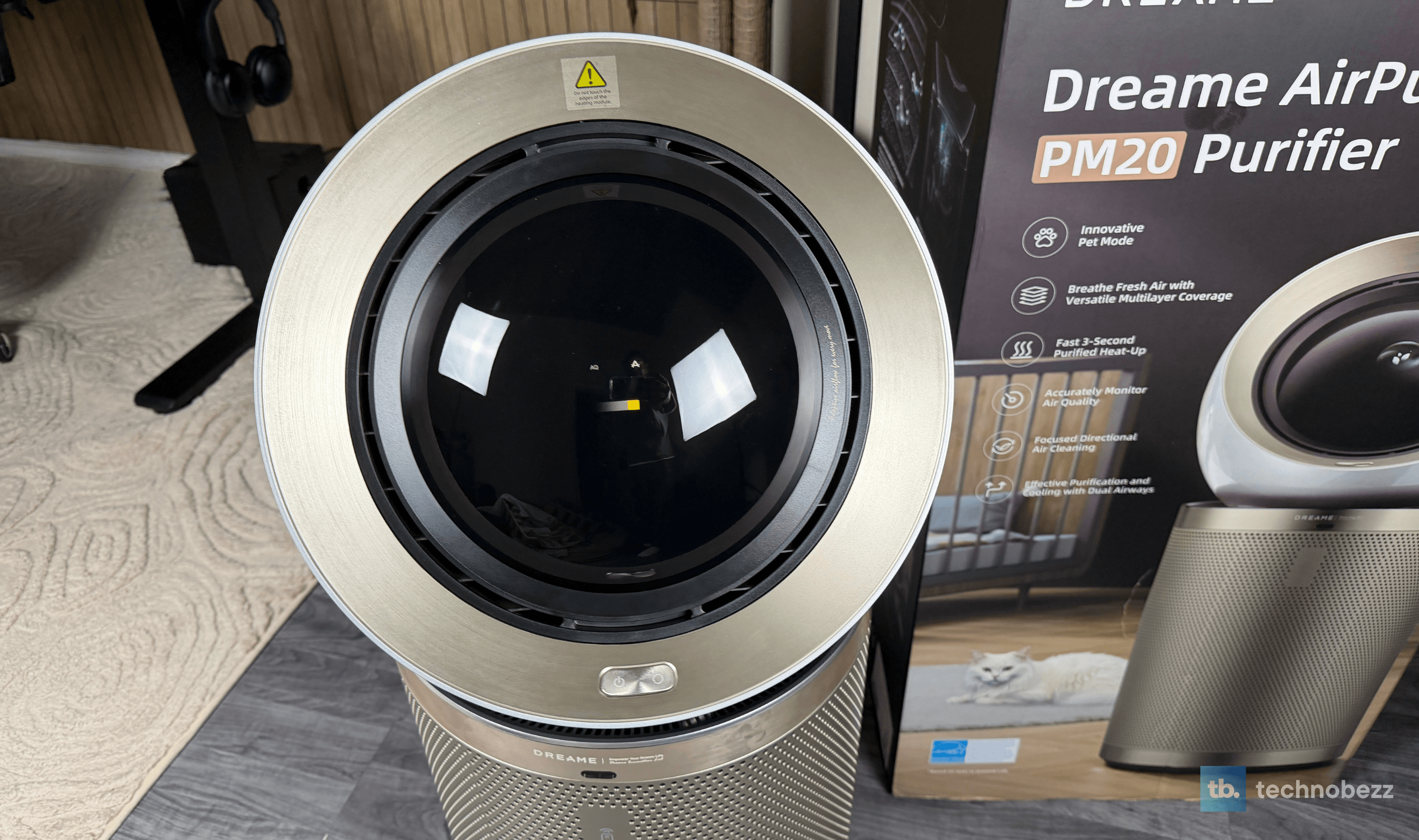Front of the Dreame AirPursue PM20's head, with the glass face and the power and mode buttons on the ring