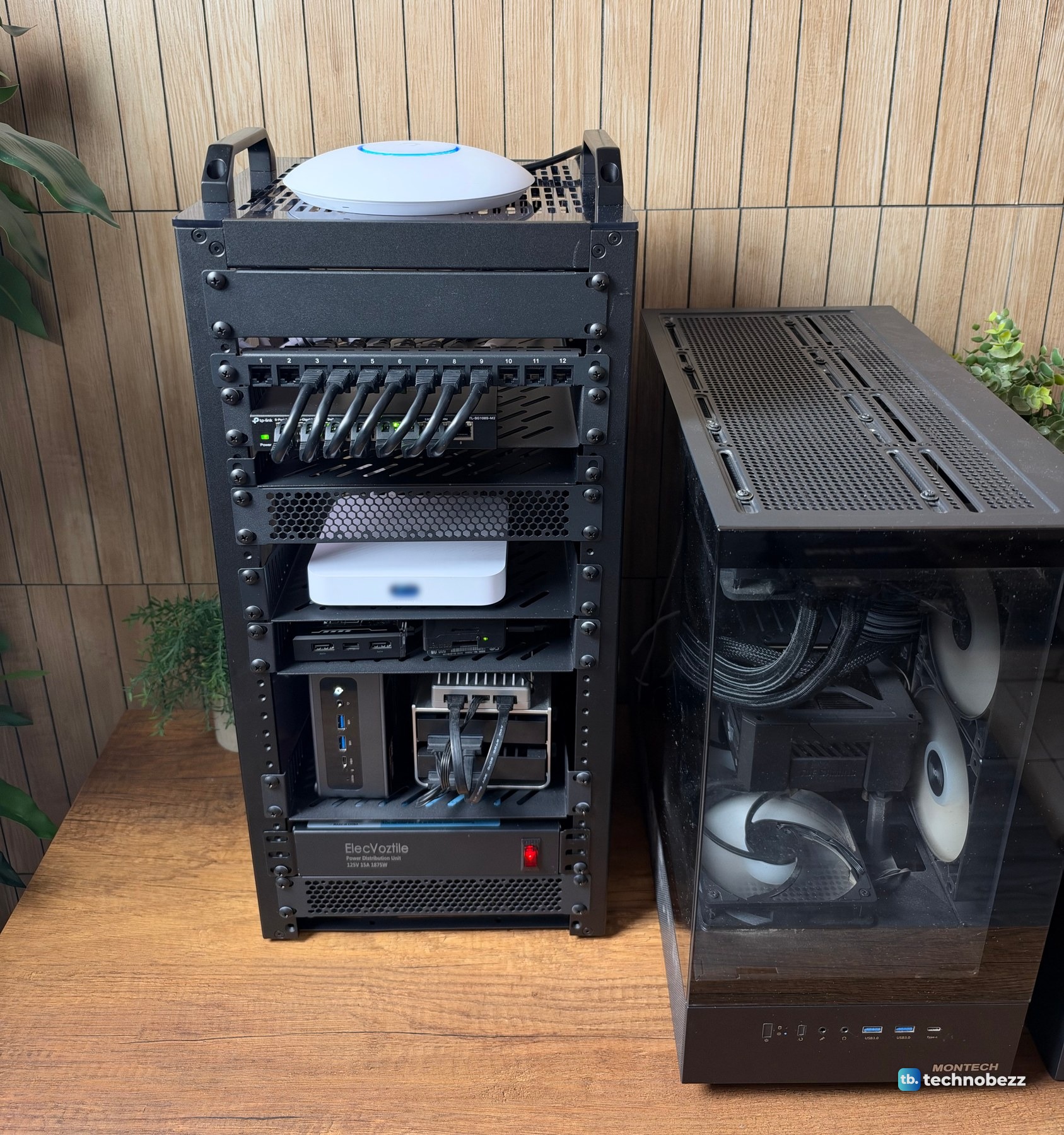The 10-inch rack with a round access point on top, standing next to a black tower PC of a similar height