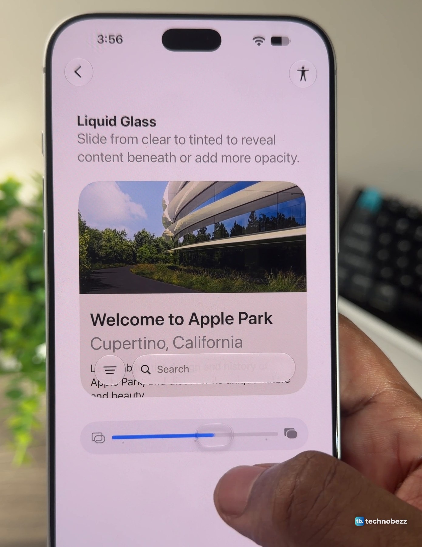 iPhone 18 Pro Max held in a hand, showing the Liquid Glass setup screen with a sample card, a slider and a search bar