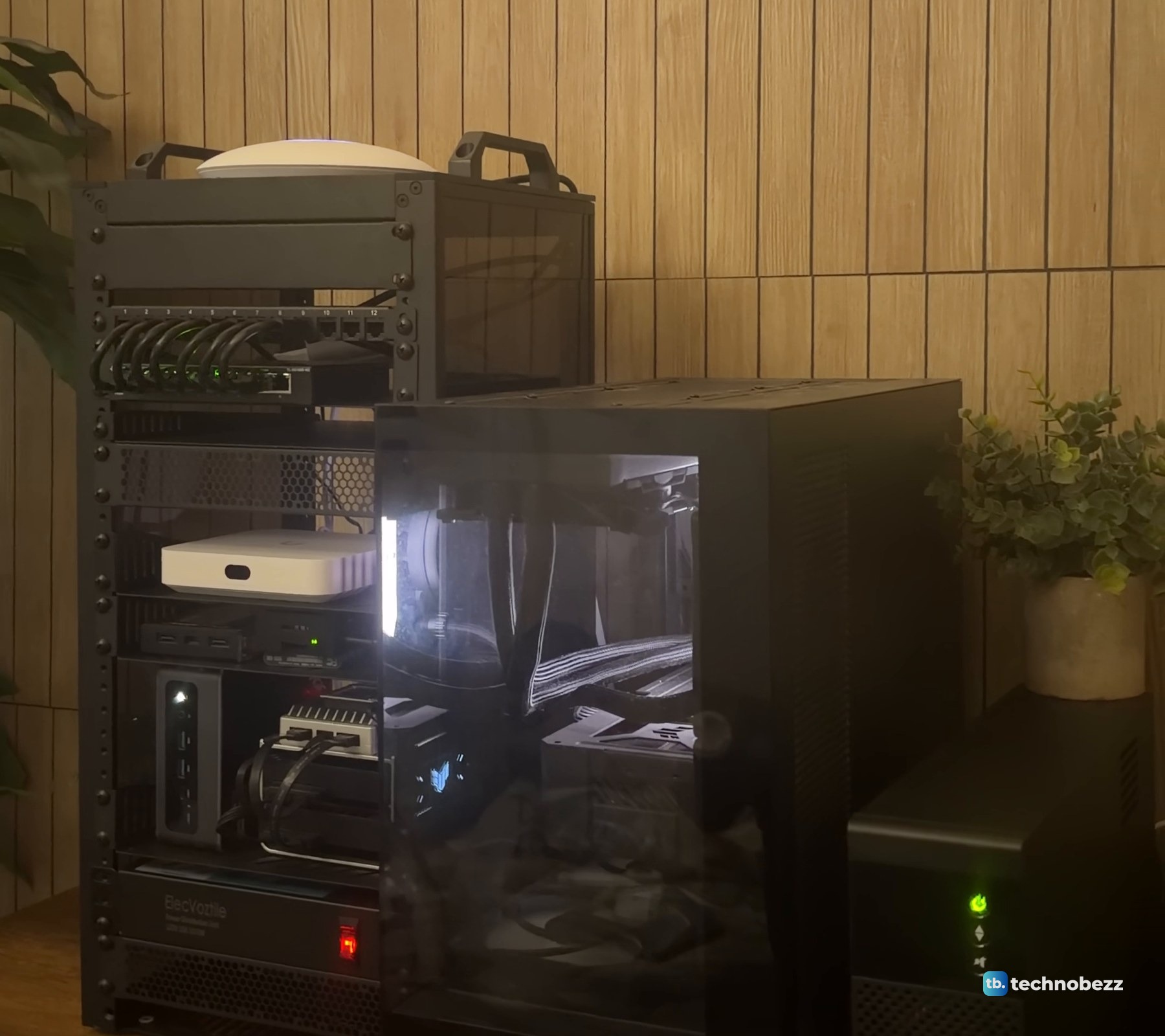 The rack, the main server and the Eaton UPS in dim warm light, with the UPS power button glowing green at the bottom right