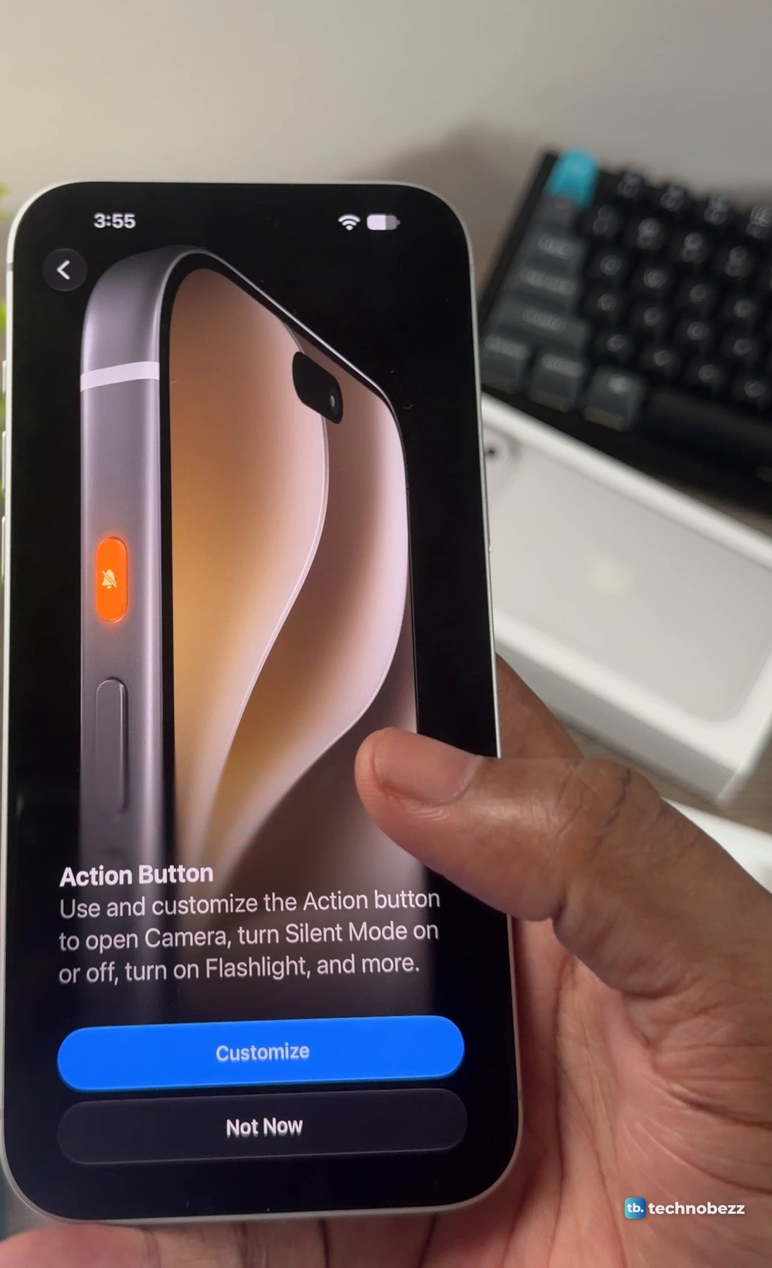 iPhone 18 Pro Max held in a hand showing the Action Button setup screen with a drawing of the phone's edge and Customize and Not Now buttons