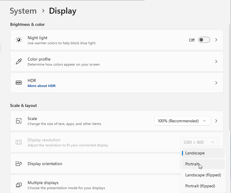 Windows 11 Display settings with the Display orientation list open showing Landscape, Portrait, Landscape (flipped) and Portrait (flipped)