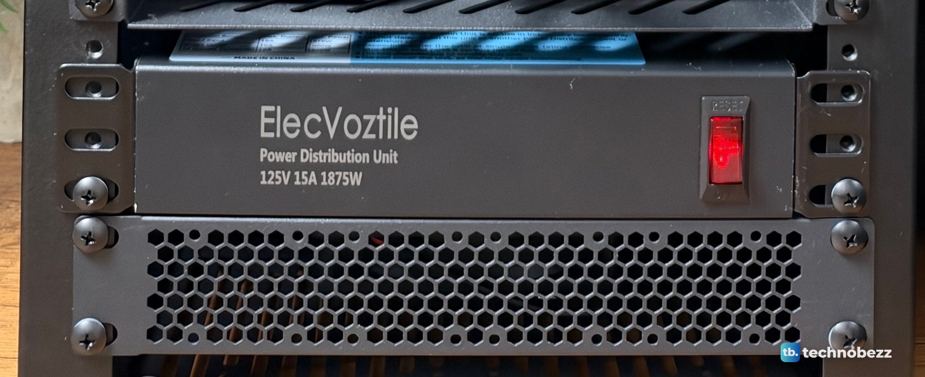 ElecVoztile 10-inch power distribution unit with a red front switch mounted near the bottom of a rack