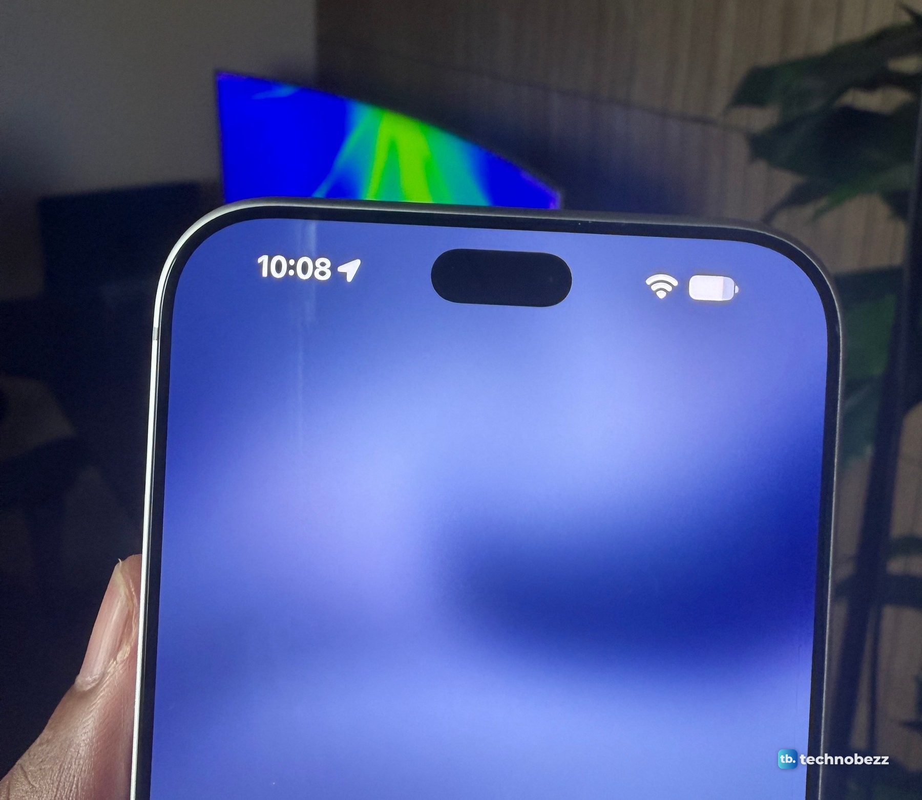 iPhone 18 Pro Max held in a hand with an empty Dynamic Island at the top of the screen