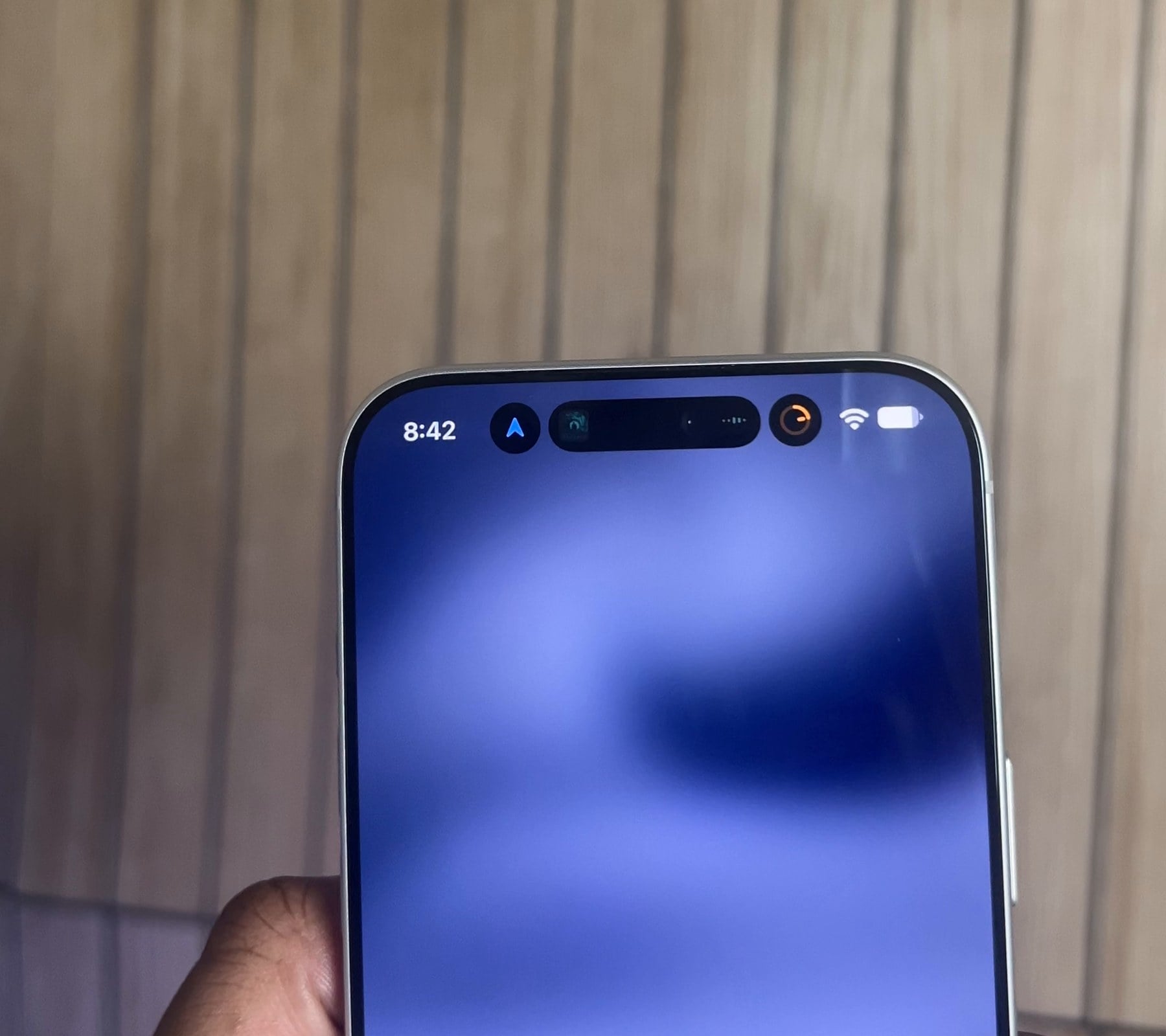 iPhone 18 Pro Max in hand with directions, music and a timer in the Dynamic Island