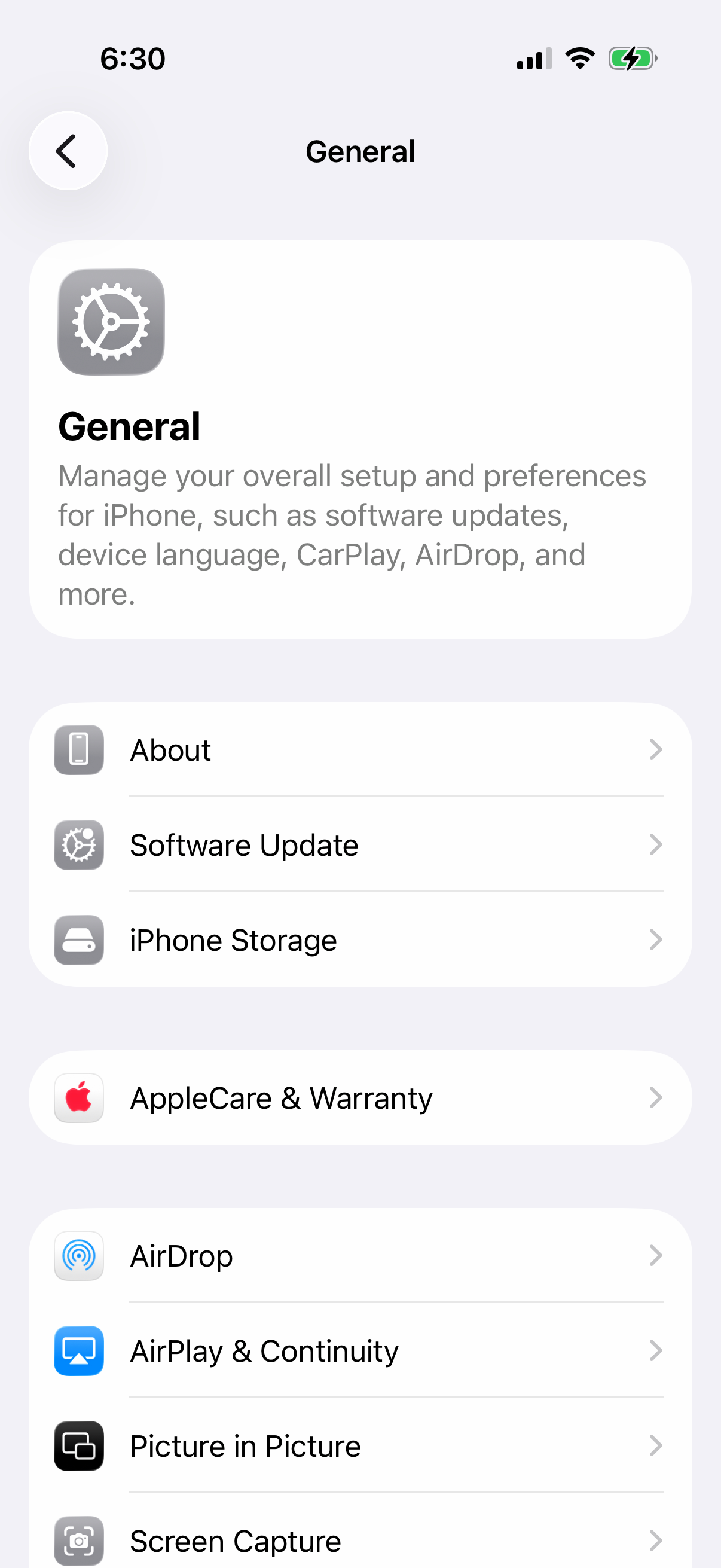 iPhone Settings General screen listing About, Software Update, iPhone Storage, AirDrop and AirPlay & Continuity