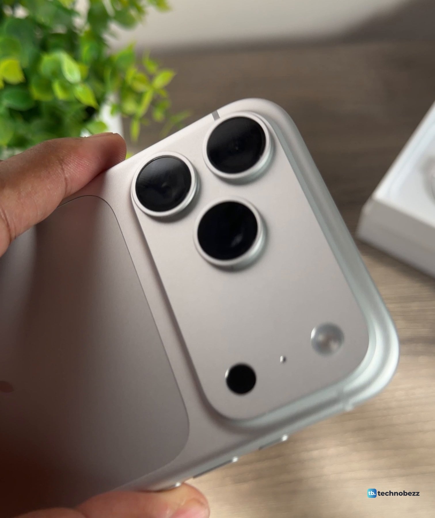 Close-up of the camera bar on a silver iPhone 18 Pro Max, showing three lenses, the flash, a pinhole and a black sensor window