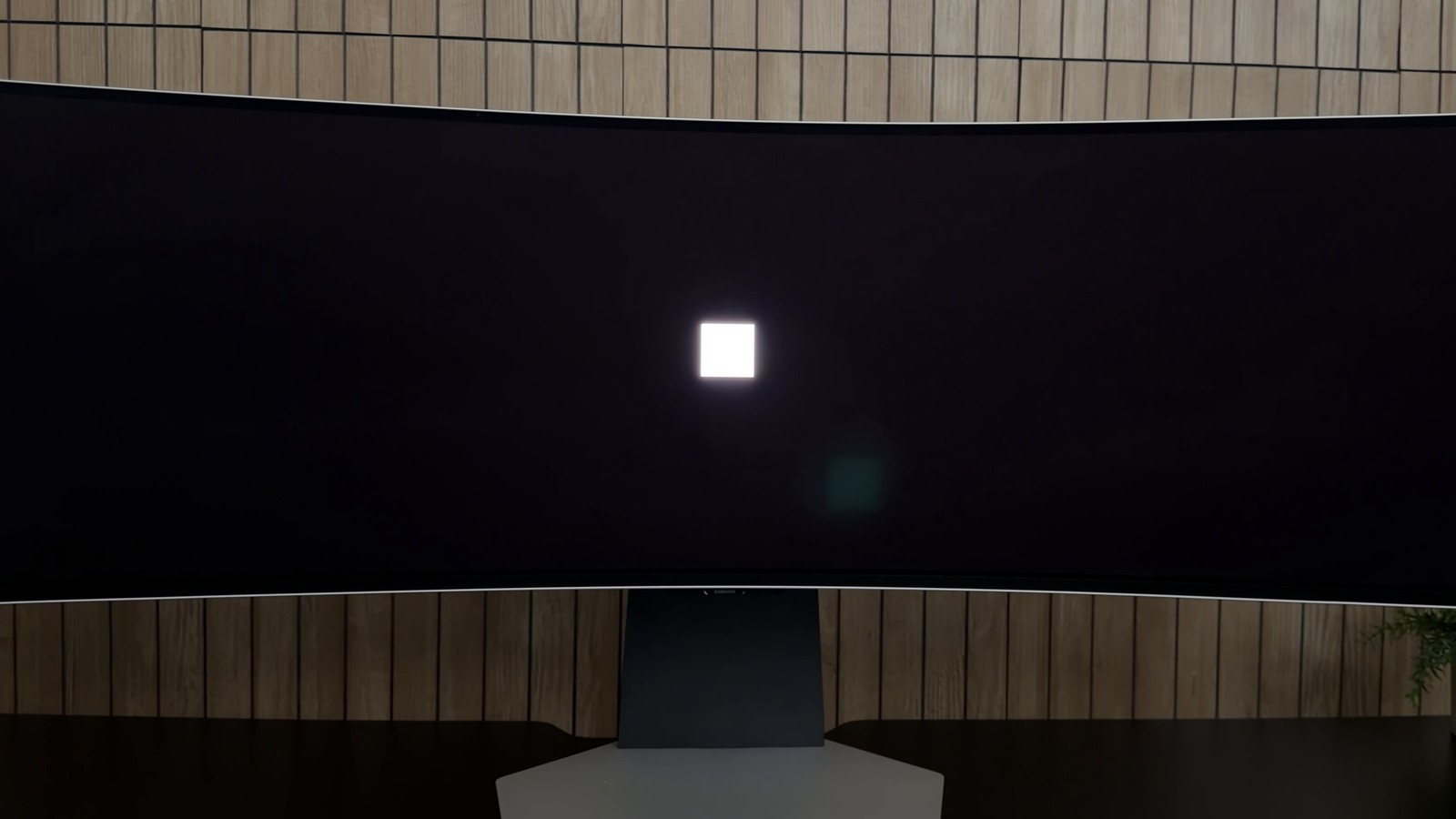 A small white square in the middle of a black screen on the Samsung Odyssey OLED G9, with no glow around it