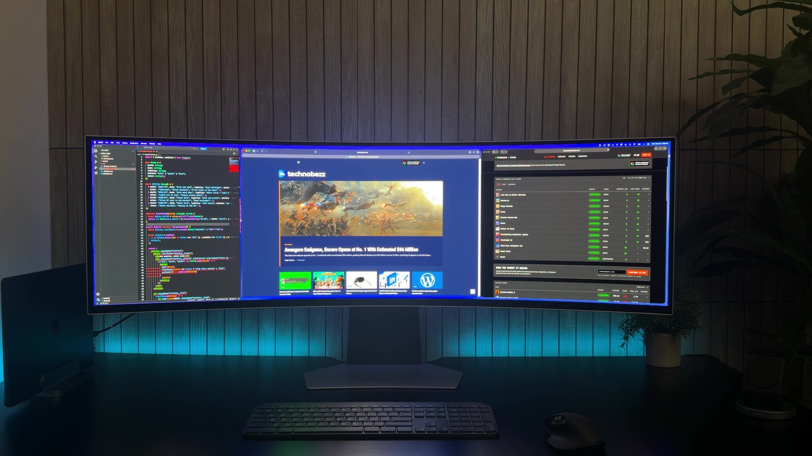Three windows tiled across the Samsung Odyssey OLED G9 with a code editor, the Technobezz homepage and a status page
